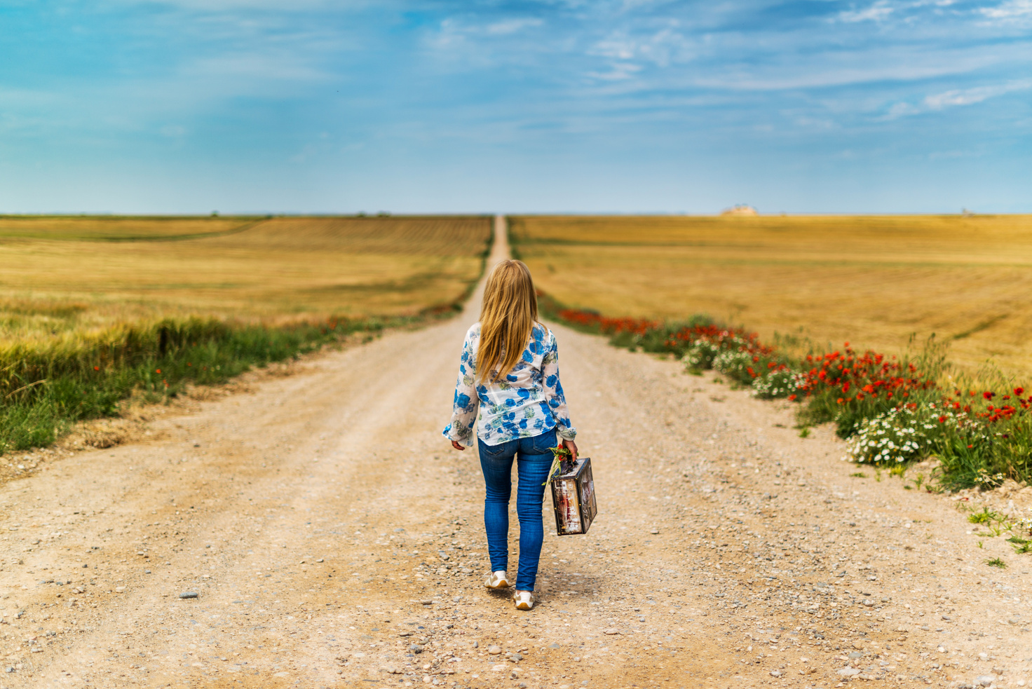 Woman Walking on Empty Road